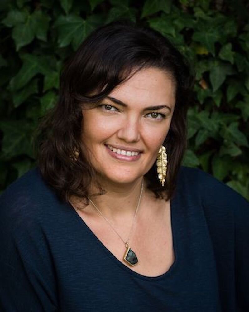 Nara attempting to balance a professional head cock while squatting in ivy and hoping nothing crawls up her leg.