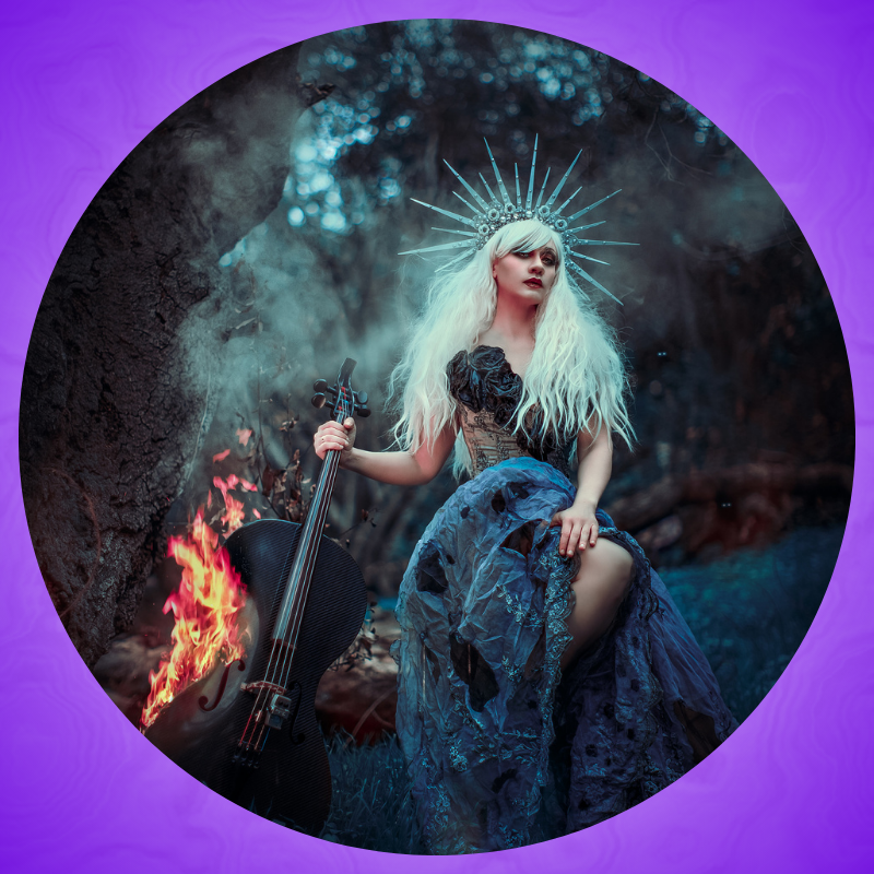 Portrait of Cellista, a woman sitting on a rock holding a cello on fire.
