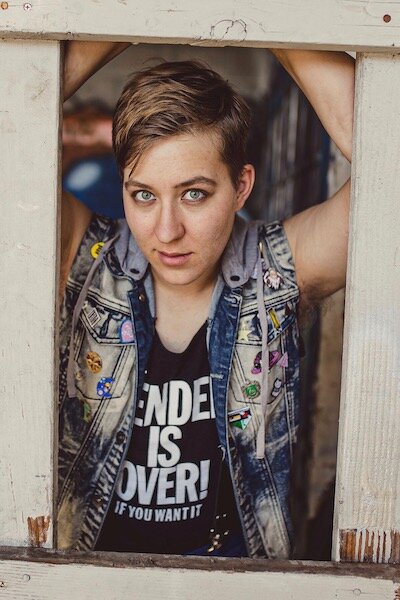 Nic A. Sommerfeld (they/them; ze)  as  Felix B. Love !  Nic A. Sommerfeld  is a Montana-born actor and playwright who received their degree from Santa Clara University. They have acted with the California Shakespeare Theater, Berkeley Playhouse, San Francisco Playhouse, Berkeley Rep, The San Francisco Shakespeare Festival, and others. They also perform as their Drag King persona Chester Vanderbox. They are thrilled to be queering it up with these cats as they embark on creating new authentically queer theater in San Francisco. Nic and their cat Tauntaun send their love.